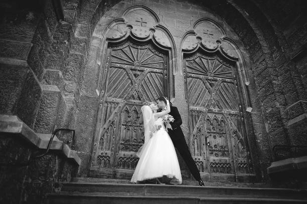 istock Wedding couple at catholic church 664533008