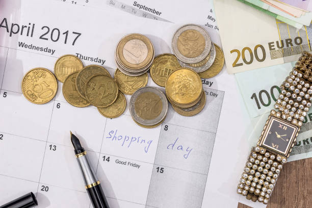 istock text shopping day write on calendar with euro banknotes, coin, pen. 664538006