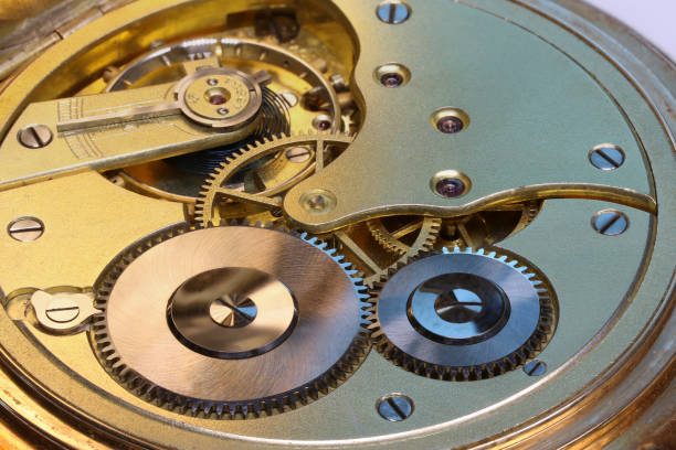 istock Old watch's mechanism, clockwork, gold with rubies 664538352