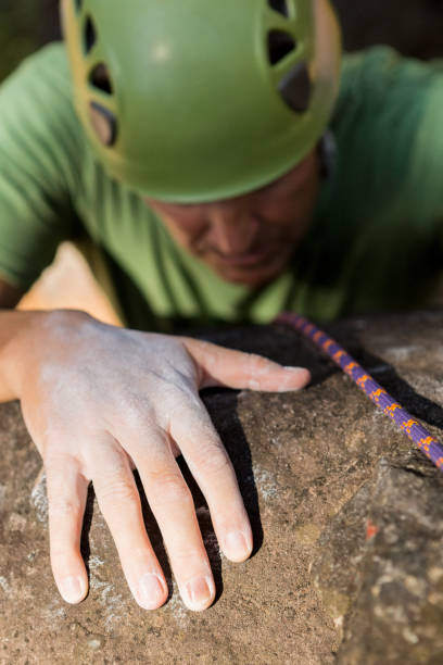 istock Close up man rock climbing 664541560