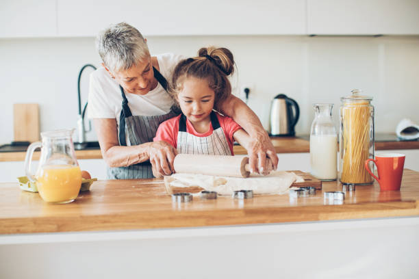 istock Granny will teach me to make cookies! 664548072