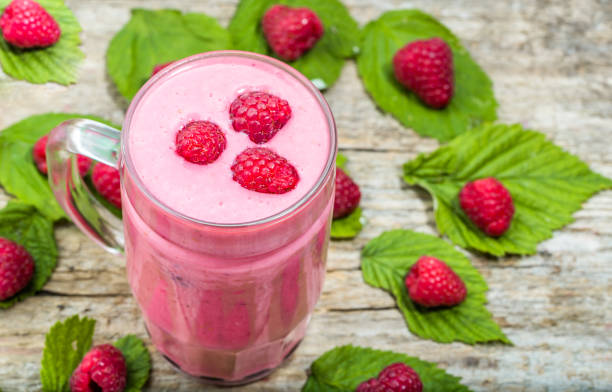 istock Healthy smoothie, fruit milkshake, raspberry heart with foam on top 664564070