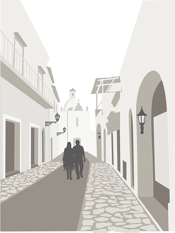 A vector silhouette illustration of a young couple walking along a cobblestone street with ornate building facades on either side.