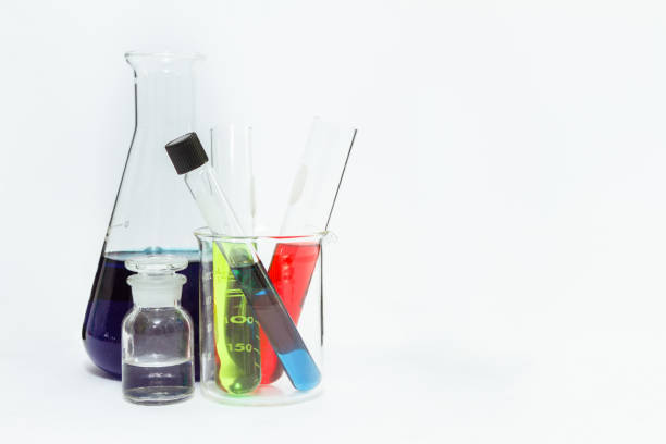 istock science laboratory glassware,Group of laboratory flasks empty or filled with a clear liquid on white tint scientific graphics background and their reflection on a table,science background,science glassware and selective focus. 664564700