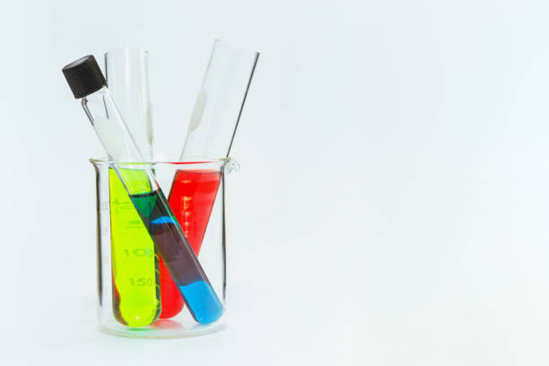 istock science laboratory glassware,Group of laboratory flasks empty or filled with a clear liquid on white tint scientific graphics background and their reflection on a table,science background,science glassware and selective focus. 664564746
