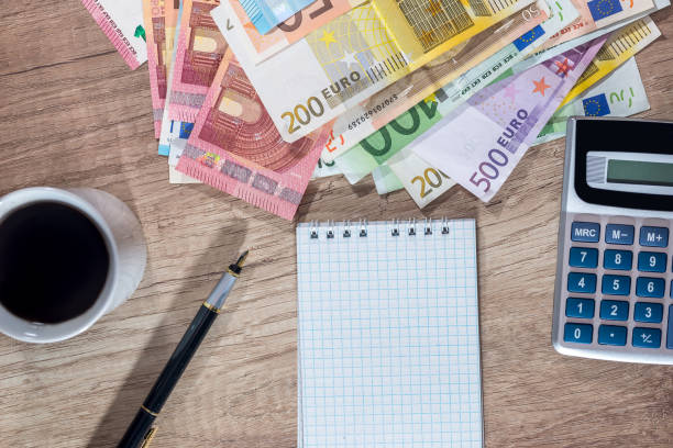 istock empty blank with euro bills, coin and calculator on desk. 664566006