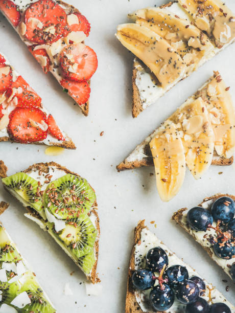 istock Healthy breakfast toasts with cream-cheese, fruit, nuts and seeds 664566086