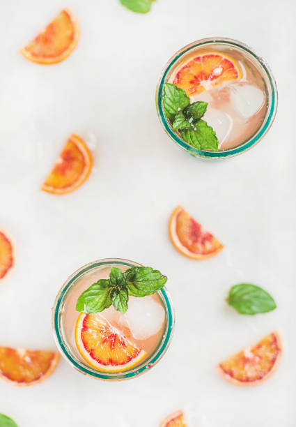istock Blood orange fresh summer lemonade in glasses, top view 664569420