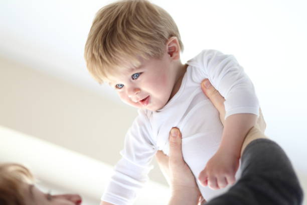 istock Grandmother lifting her grandchild 664572268