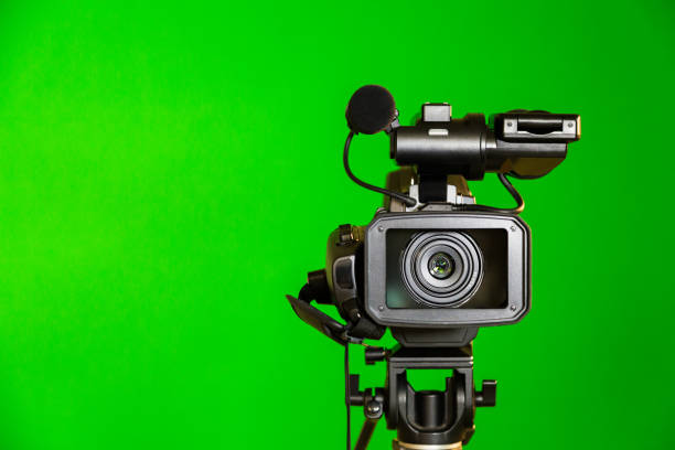 Camcorder on a green background. Filming in the interior. The chroma key Camcorder on a green background. Filming in the interior. The chroma key. reportage stock pictures, royalty-free photos & images