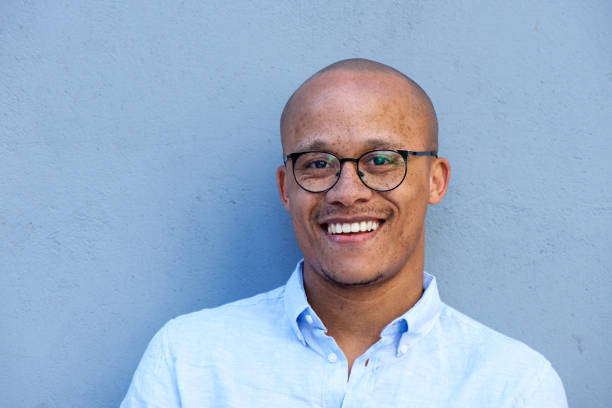 Close up smiling african american businessman with glasses Close up portrait of smiling african american businessman with glasses men hairstyle afro cool stock pictures, royalty-free photos & images