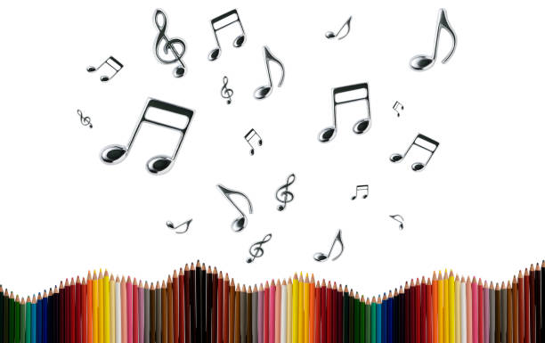Row of colored pencils with many flying musical notes against white background.