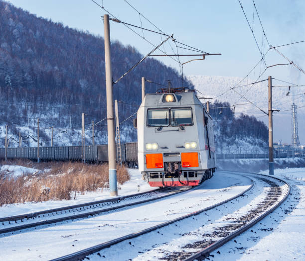 istock Freight train moves along Baikal lake. 664580276