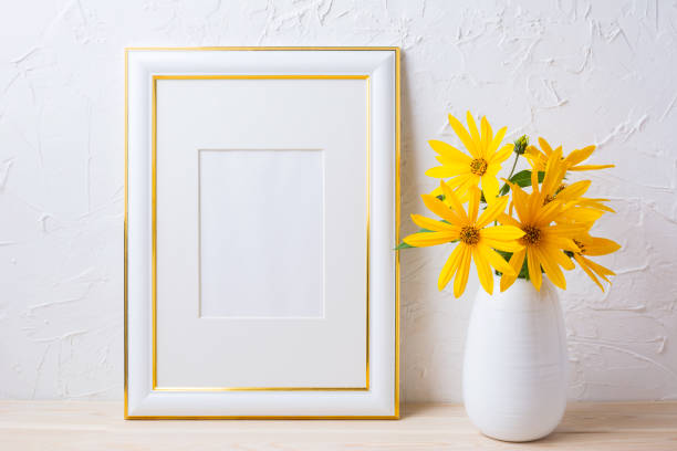 istock Gold decorated frame mockup with yellow rosinweed flowers 664581100