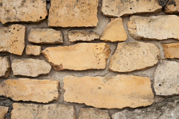 istock Background image of a wall made of masonry. 664582112