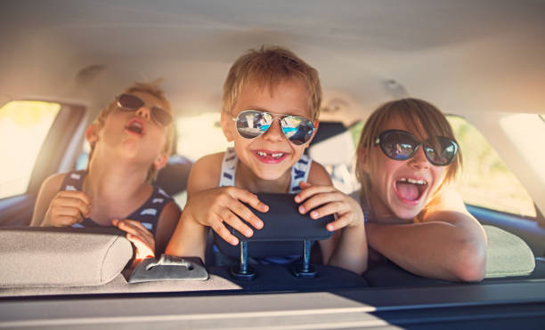 istock Three kids having fun on road trip 664584858