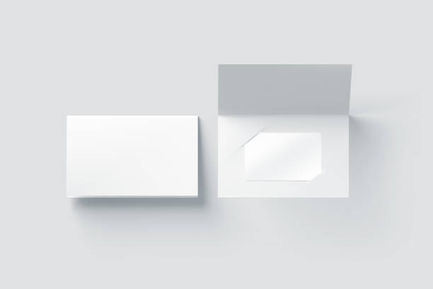 istock Blank white plastic card mockup inside paper booklet holder 664587338