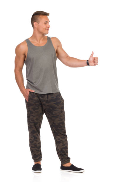 istock Smiling Fit Man Gives Thumb Up 664587606