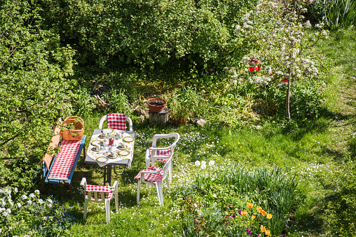 Weimar, Germany: A beautiful laid table at summertime in a garden.