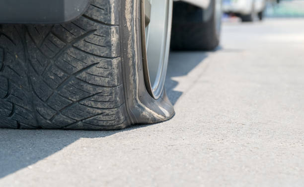 istock Flat  tire car on street. 664591238