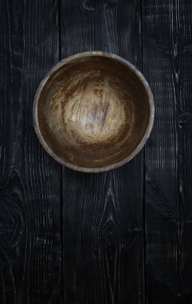 istock Empty wooden bowl on a vintage table 664595230