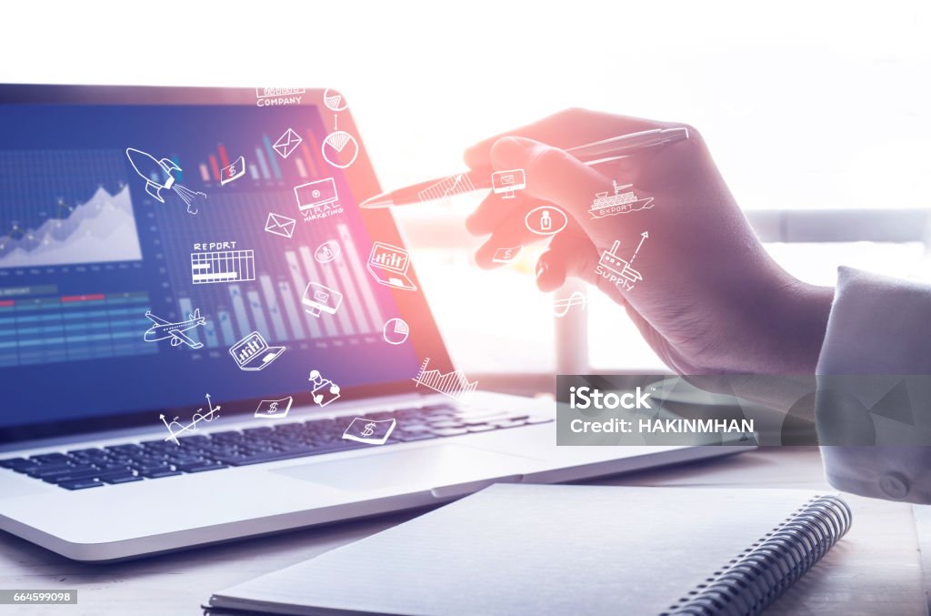 Businessman working with  modern laptop and icon.strategy concept Businessman using modern laptop with graph.Business startup.Analyze strategy conceptsBusinessman using modern laptop with graph.Business startup.Analyze strategy conceptsStrategy text with business icon on modern laptop screen with graph chart background.marketing success and goals concept ideas Digitally Generated Image Stock Photo