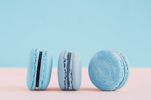 Blue french macaroons. Copy space for text. Postcard. Horizontal