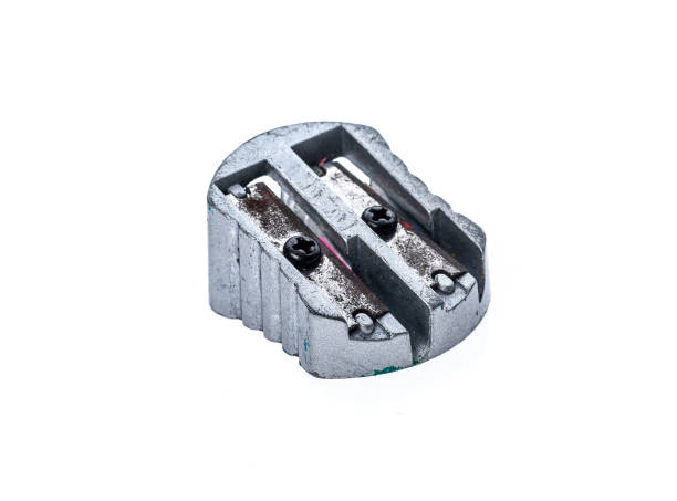 istock Old used silver metallic steel pencil sharpener isolated on white. 664599946