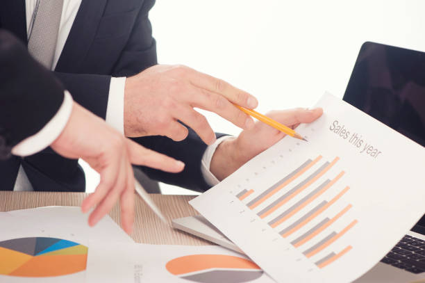 istock Business people during paperwork at meeting 664603314