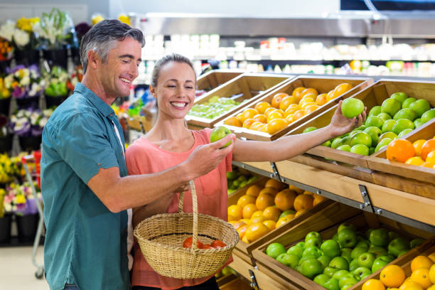 istock Happy couple holding an apple 664603940