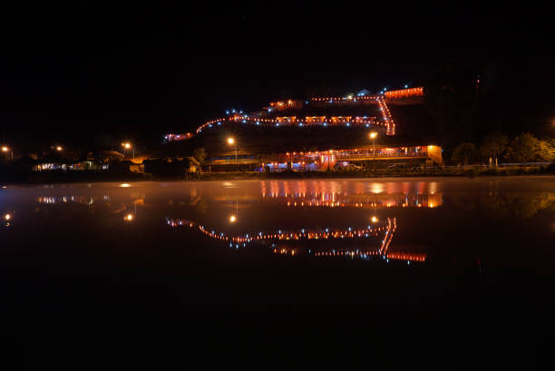 istock reflection of town in river 664604066