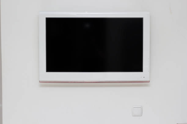 istock Wide screen TV on the wall 664607062