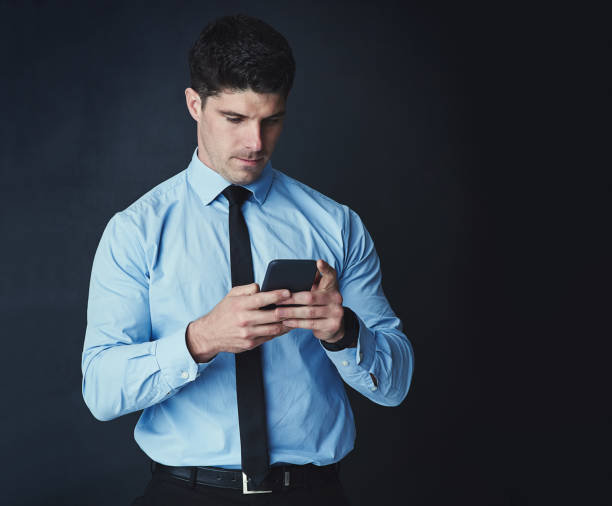 istock Organising his schedule on his phone 664607868