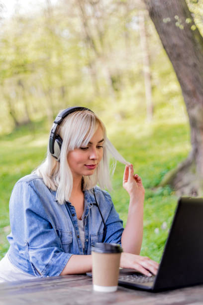 istock Browsing happily to her favorite songs 664614664