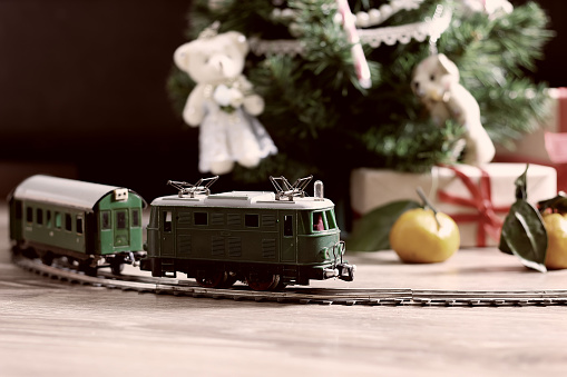 retro train under tree gift on christmas time