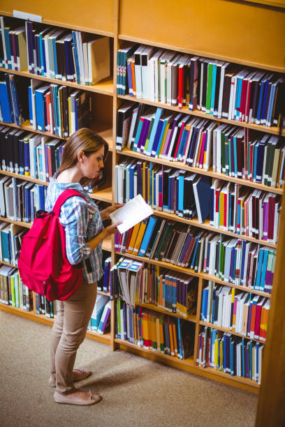 istock Mature student in the library 664619442