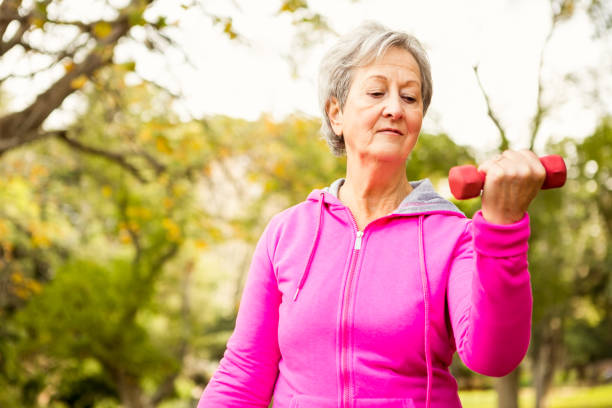 istock Senior woman in the park 664619682