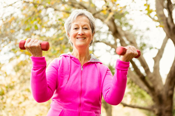 istock Senior woman in the park 664619818