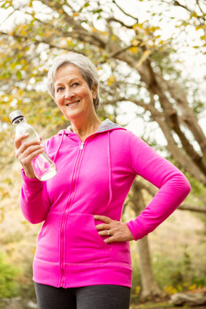 istock Senior woman in the park 664620008