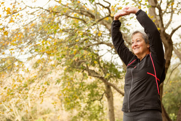 istock Senior woman in the park 664620126