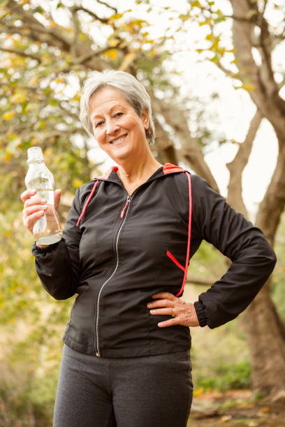 istock Senior woman in the park 664620356