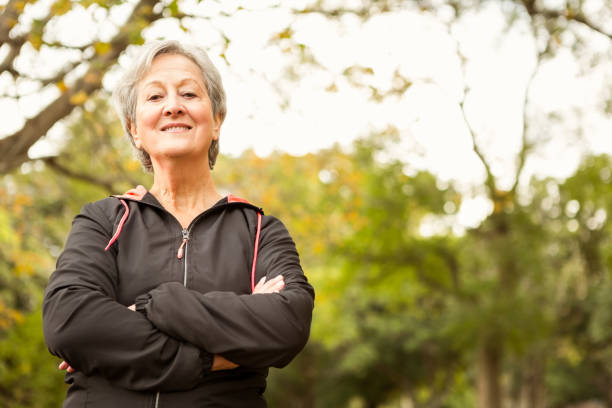 istock Senior woman in the park 664620392