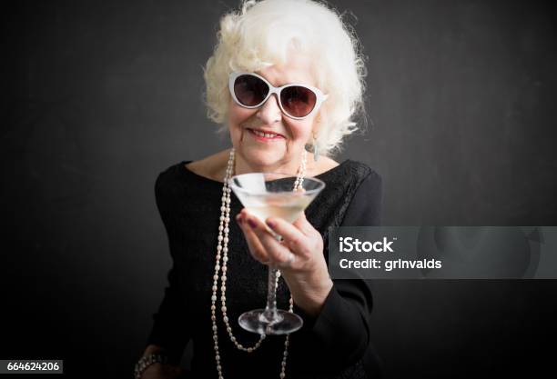 Cool Grandma Havinga A Drink Stock Photo - Download Image Now - Grandmother, Wealth, Senior Women