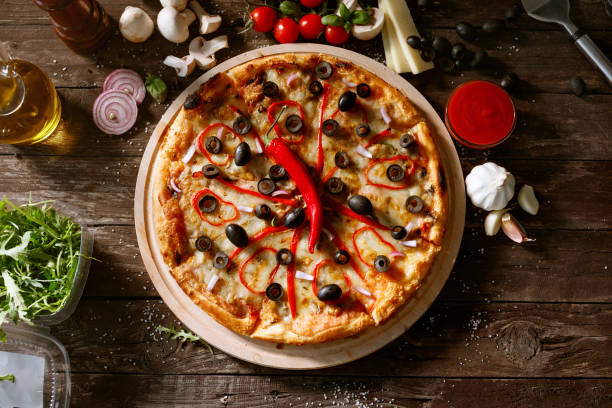 istock top view pizza with fresh red pepper and ingredients on table 664624230