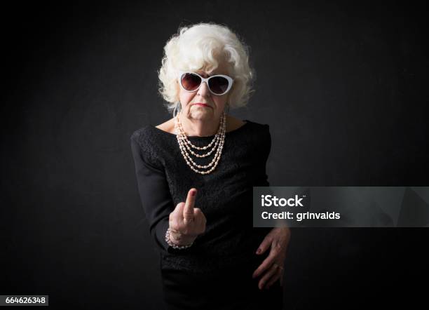 Grandmother Flipping People Off Stock Photo - Download Image Now - Senior Women, Women, Obscene Gesture