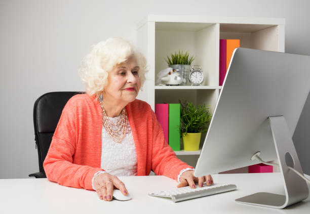 istock older woman working in the office 664626496