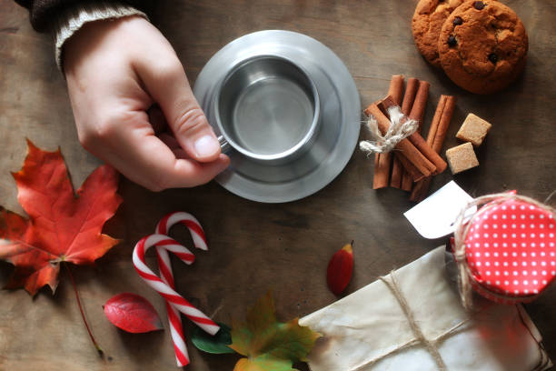 istock hands holding a mug of hot coffee on a table 664626788