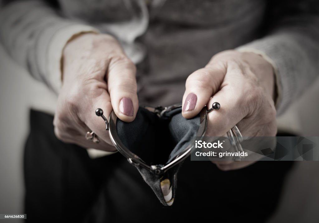 Older person holding money wallet open Older person holding money empty  wallet open Senior Adult Stock Photo