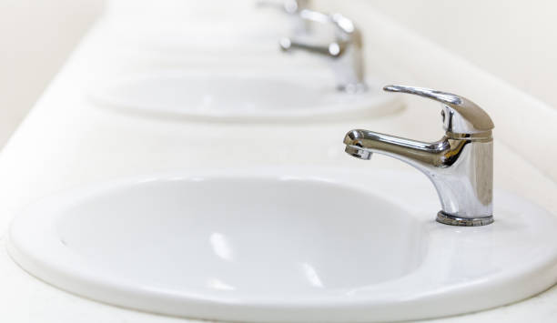 istock faucet and sink in a public toilet 664627644