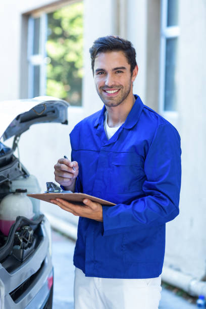 istock Portrait of happy engineer with notepad 664634864
